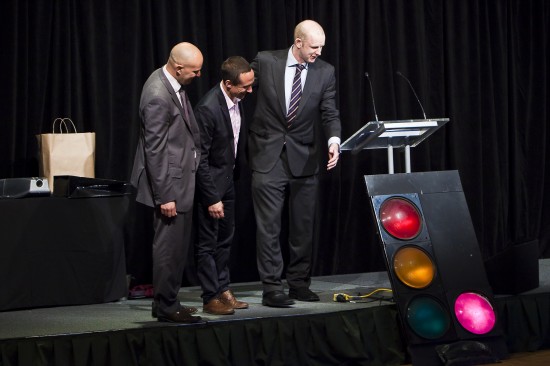 Robin Miles, Paul Beale and Tony Wilson switch on the mauve traffic light